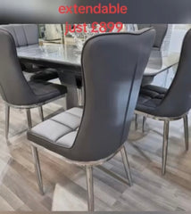 Extendable dining table with six chairs offering flexibility and stylish functionality.