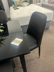 Glass extendable dining table with four chairs