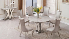 Charisma round marble dining table with four chairs for contemporary dining rooms.